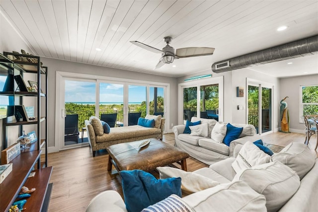 sunroom / solarium featuring ceiling fan and wooden ceiling