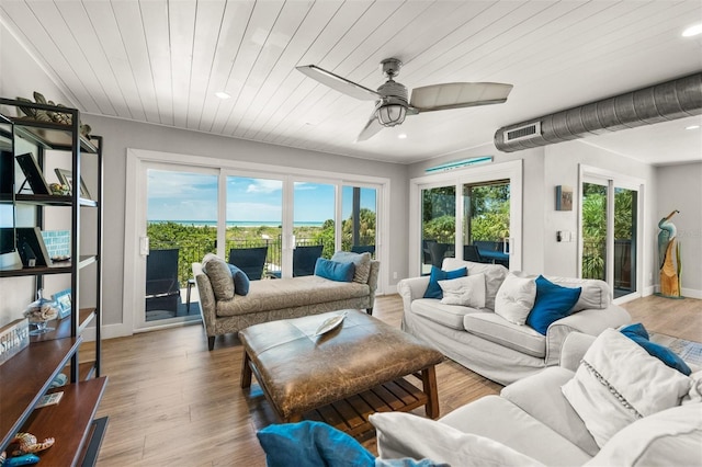 sunroom / solarium with ceiling fan and wood ceiling