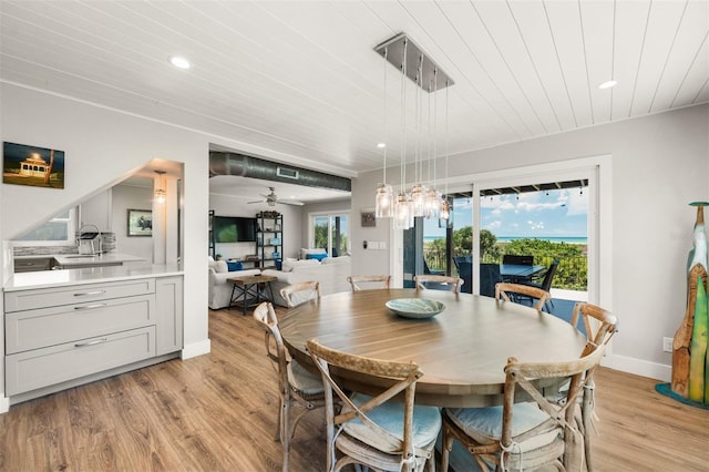 dining area with wooden ceiling, a wealth of natural light, light hardwood / wood-style flooring, and ceiling fan