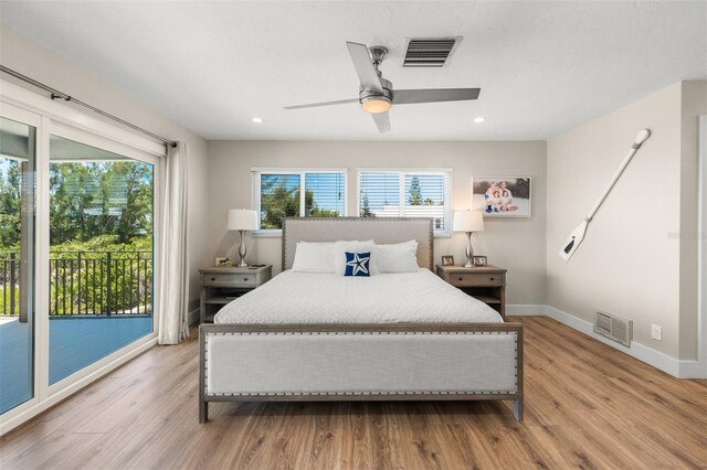 bedroom with ceiling fan, access to exterior, and light hardwood / wood-style floors