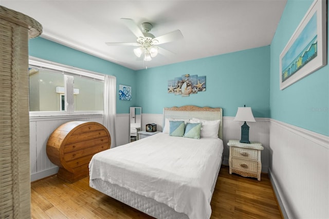 bedroom featuring ceiling fan and wood-type flooring