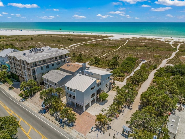 bird's eye view featuring a view of the beach and a water view