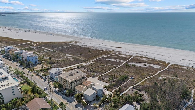 bird's eye view with a view of the beach and a water view