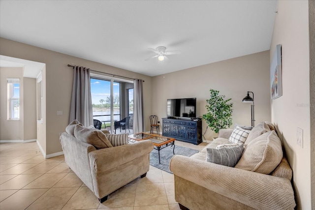 tiled living room with ceiling fan