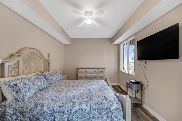 bedroom featuring ceiling fan and dark wood-type flooring