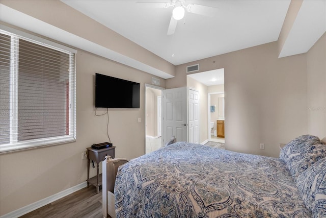 bedroom featuring ceiling fan, hardwood / wood-style flooring, and ensuite bathroom