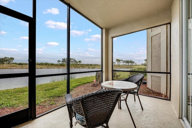 sunroom with a water view