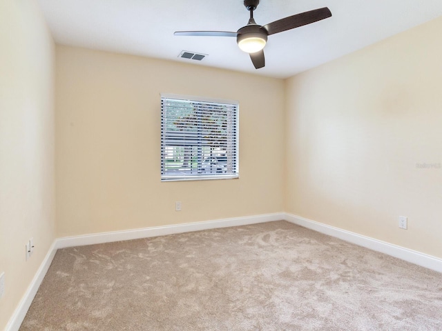 carpeted empty room with ceiling fan