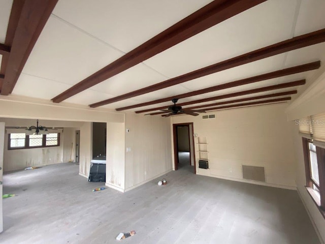 unfurnished living room with beam ceiling, ceiling fan, and light hardwood / wood-style floors