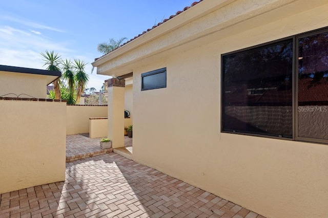 view of patio featuring fence