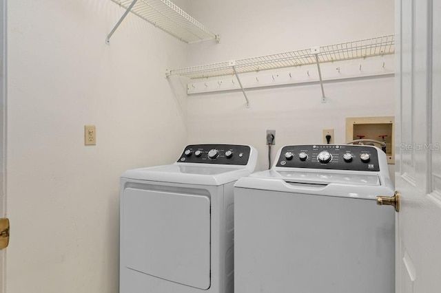 laundry area with laundry area and separate washer and dryer