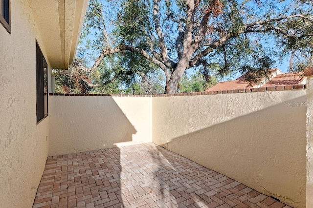 view of patio / terrace featuring fence