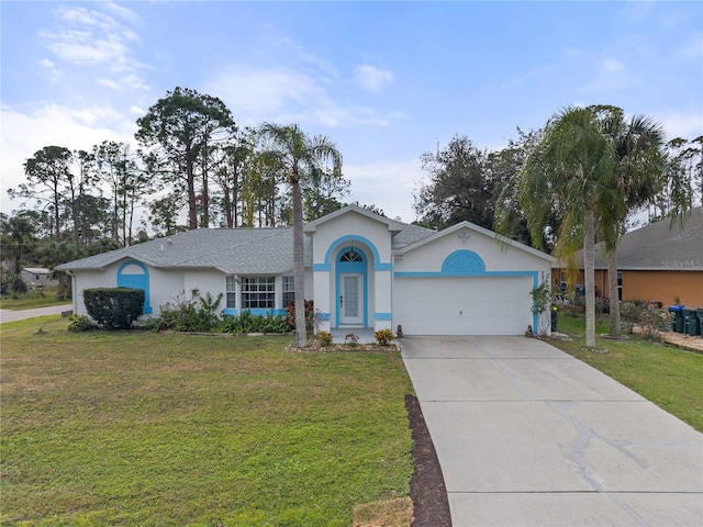 ranch-style house featuring a garage and a front lawn