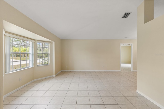 empty room with light tile patterned floors