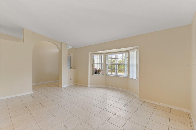 empty room with light tile patterned floors