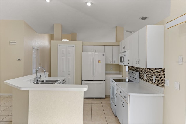 kitchen with white appliances, sink, a center island with sink, white cabinets, and light tile patterned flooring