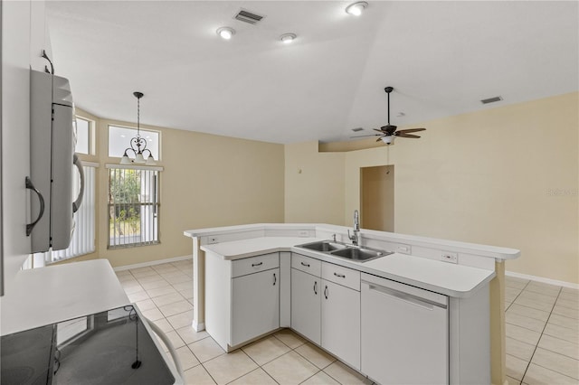 kitchen featuring white cabinetry, sink, white dishwasher, and decorative light fixtures