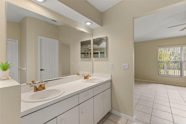 bathroom with tile patterned floors, ceiling fan, and vanity