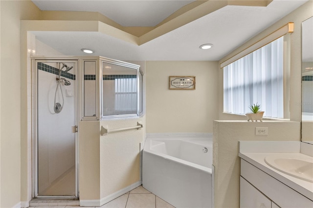 bathroom featuring tile patterned floors, plus walk in shower, and vanity