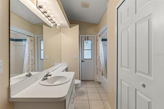 full bathroom featuring tile patterned flooring, vanity, toilet, and shower / tub combo with curtain