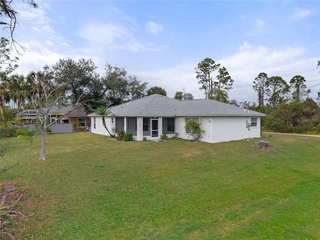 ranch-style house with a front yard