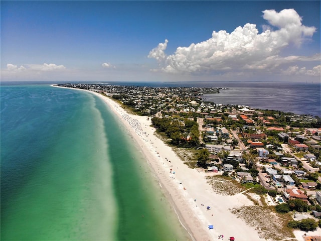 aerial view with a water view and a beach view