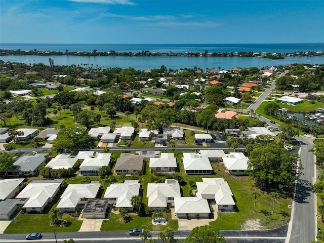 drone / aerial view with a water view