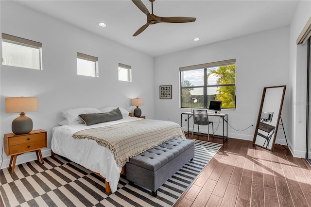 bedroom featuring dark hardwood / wood-style flooring and ceiling fan