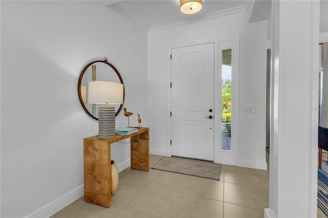 entrance foyer with light tile patterned floors and ornamental molding