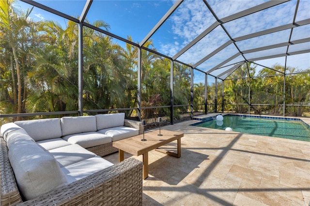 view of pool featuring a patio area, an outdoor living space, and glass enclosure