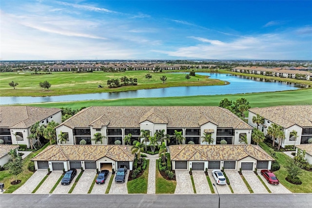 birds eye view of property featuring a water view