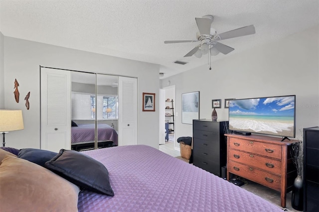 bedroom with a textured ceiling, a closet, and ceiling fan