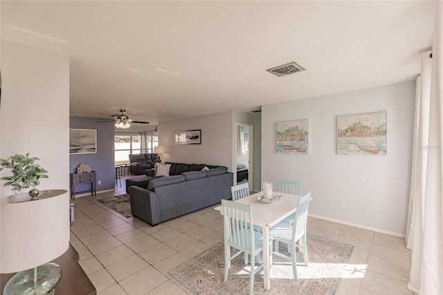 tiled dining area featuring ceiling fan