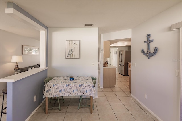 interior space featuring light tile patterned floors