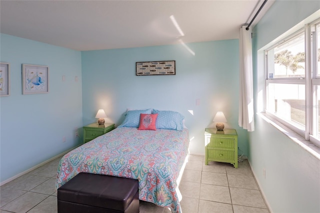 bedroom featuring light tile patterned floors