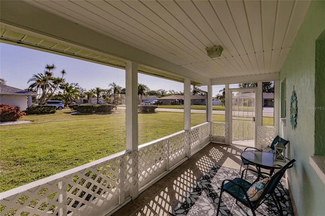 sunroom featuring wood ceiling