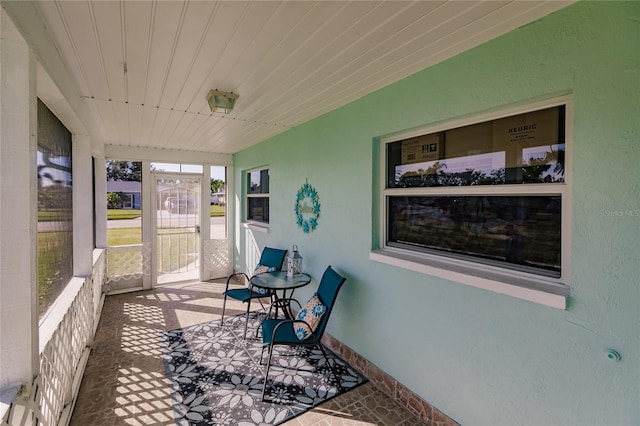 sunroom with wooden ceiling