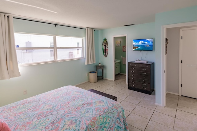 bedroom with light tile patterned floors