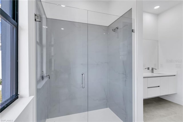 bathroom with vanity and walk in shower