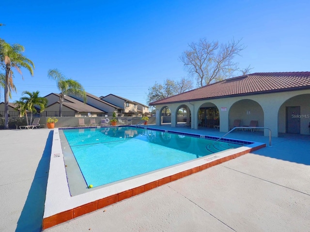 view of swimming pool with a patio area