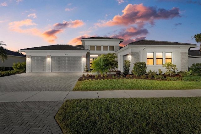 prairie-style home featuring a garage