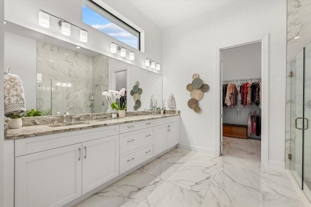 bathroom featuring vanity and a shower with shower door