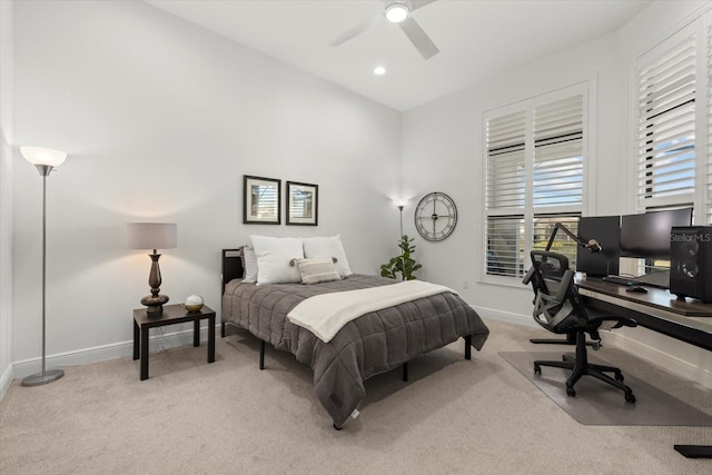 bedroom with ceiling fan, light carpet, and vaulted ceiling