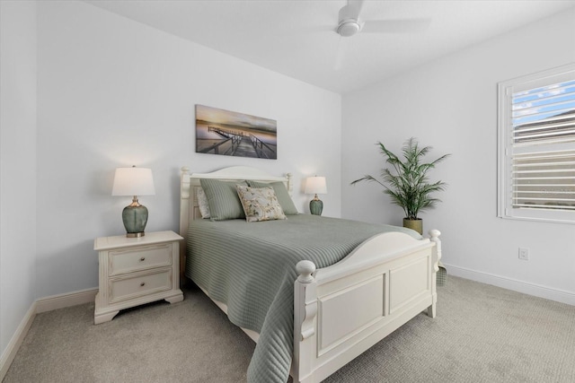 bedroom featuring ceiling fan and light carpet