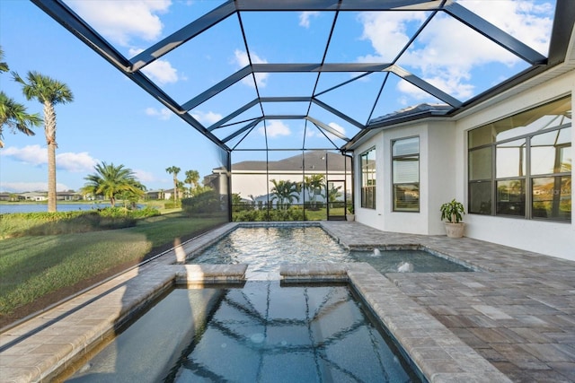 view of swimming pool featuring an in ground hot tub, a water view, and glass enclosure