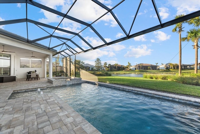 view of swimming pool featuring a jacuzzi, ceiling fan, a water view, glass enclosure, and a patio area