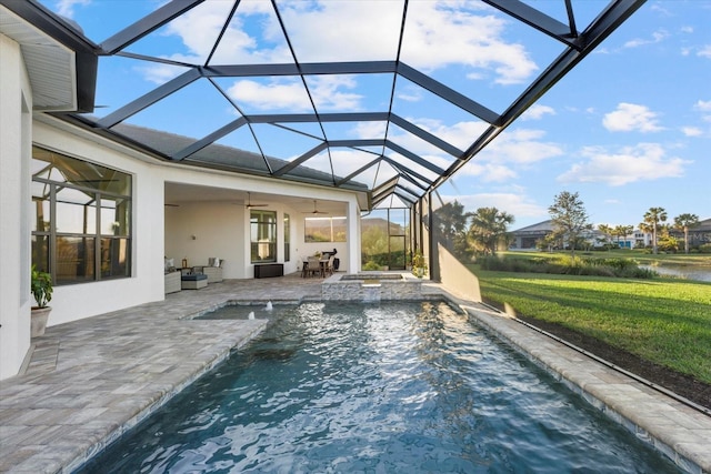 view of swimming pool with a lanai, ceiling fan, a water view, a patio, and a hot tub