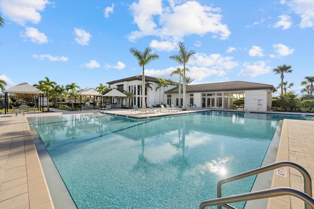 view of swimming pool with a gazebo and a patio area