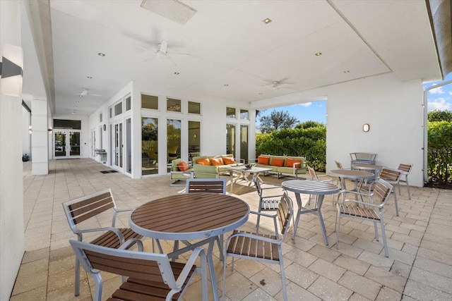 view of patio with ceiling fan, an outdoor hangout area, and french doors