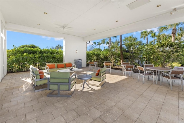 view of patio featuring an outdoor living space and ceiling fan